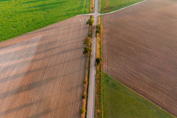 Drone aerial view with agricultural fields at sunrise in Germany
