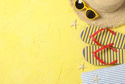 Summer vacation accessories on color background, space for text and top view. Happy holidays