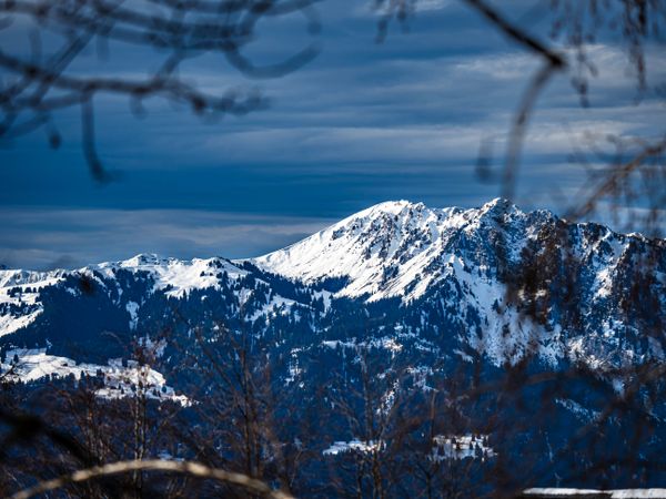 Swiss Alps winter landscape with snow and sun, mountains in Europe