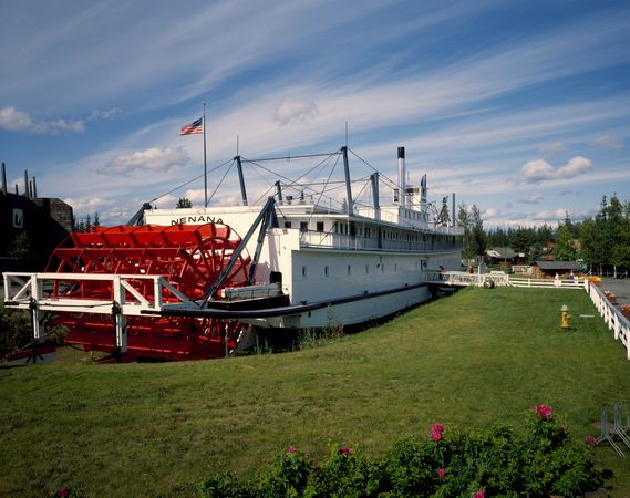 Riverboat “Nenana” with red paddle parked on display in Fairbanks, Alaska