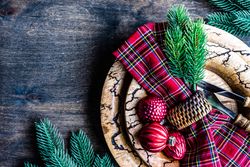Christmas card concept with baubles and tartan napkin