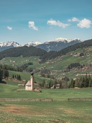 Small beautiful village between mountains with snow