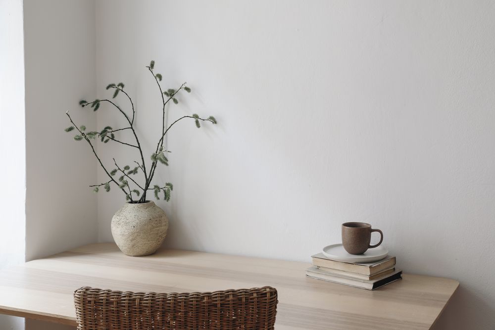 Desk with vase, coffee and books