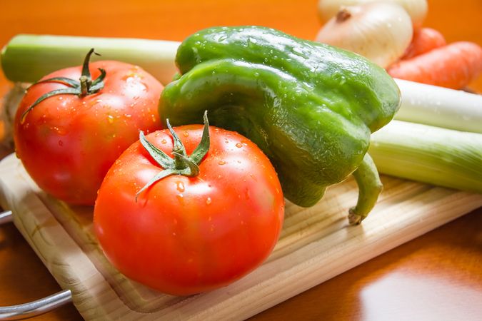 Fresh vegetables on cutting board in the kitchen
