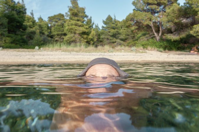Man swimming under water in sea