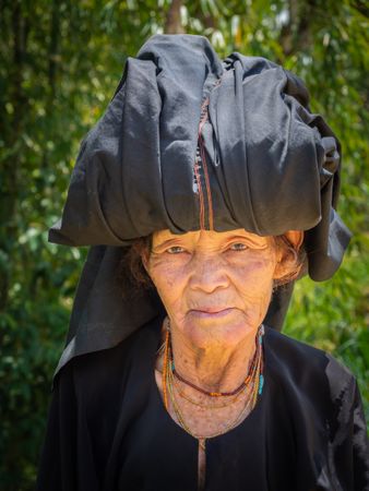 Sulawesi Island, Indonesia - August, 15 2015: Mature woman in shed in village