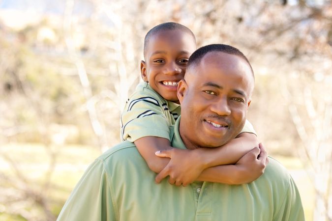 Black Man and Child Having Fun