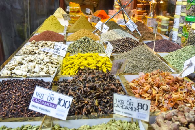 Assorted spices with price tags on display in market in Doha, Qatar
