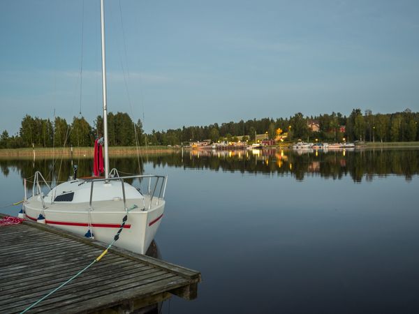 Yacht at pier on lakeside in Finland