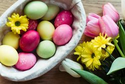 Flowers and Easter eggs on table