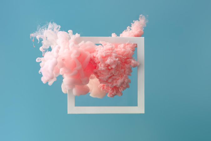 Cloud-like pink color paint with  light frame on blue background