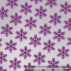 Pattern of decorative purple snowflakes beloP4
