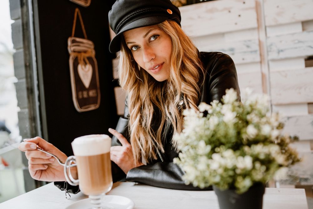 Woman drinking coffee from a glass