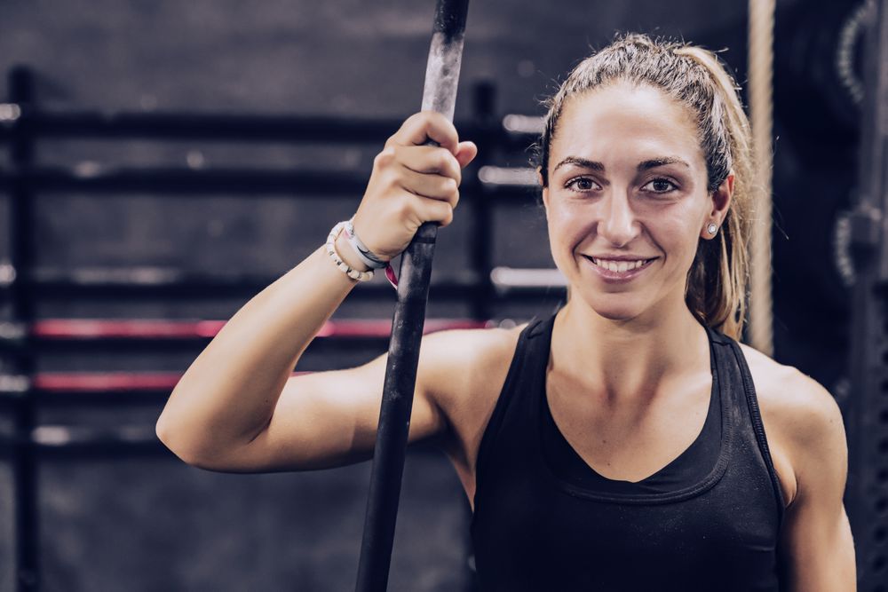 Serene woman relaxing in gym
