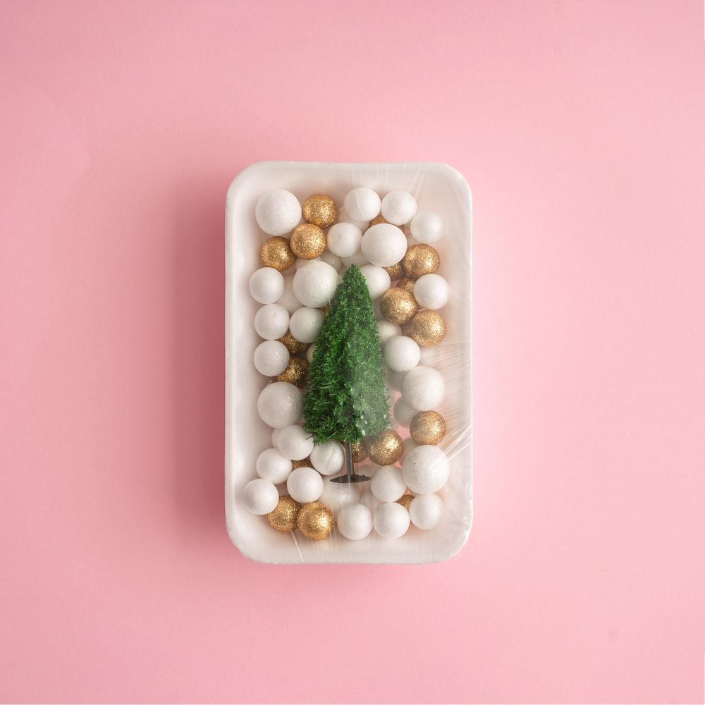Christmas tree and ball decoration packed in plastic wrap