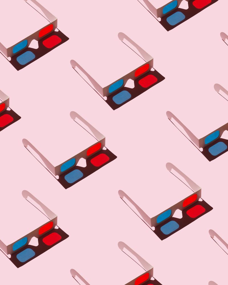 3D glasses on pink background