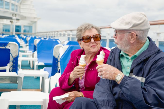 Adult Couple Enjoying Ice Cream On The Deck of a Luxury Passenger Cruise Ship.