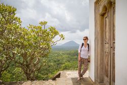 Woman leaning on old temple