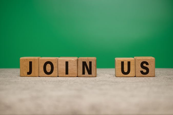 join us words on wooden blocks isolated on green background. concept of business hiring employee