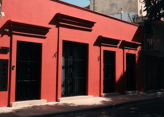Red building with dark large doors
