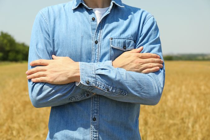 Young man in barley field. Agriculture business. Farming