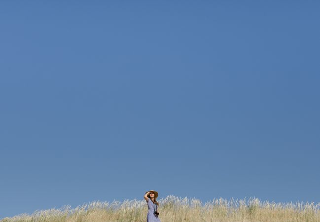 Young female photographer on forest