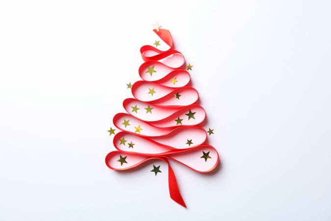Christmas tree made from red ribbon and glitter on light background, space for text
