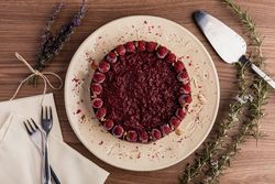 Fruit berry pie and branch of lavender on table