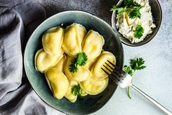 Traditional Ukrainian vareniki in grey bowl