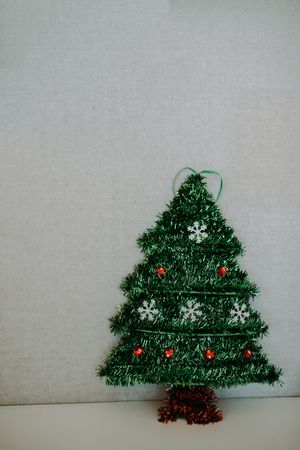 Mini Christmas tree on light background