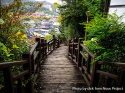 Wooden path with traditional houses in the background 0VpoG4