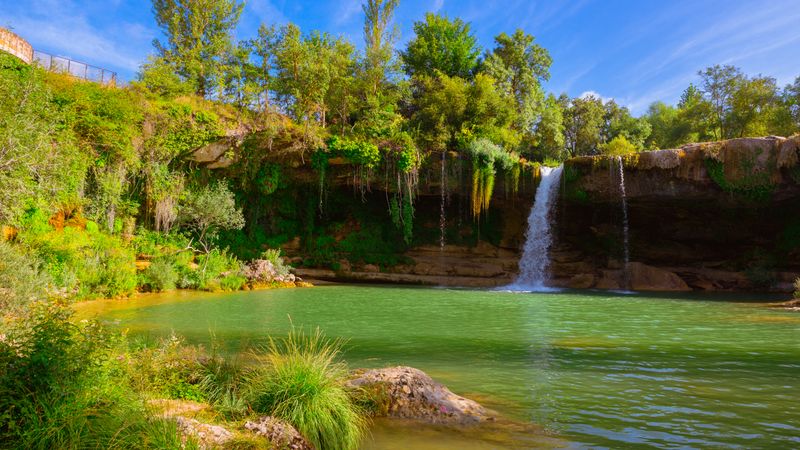 View of beautiful waterfall and lake