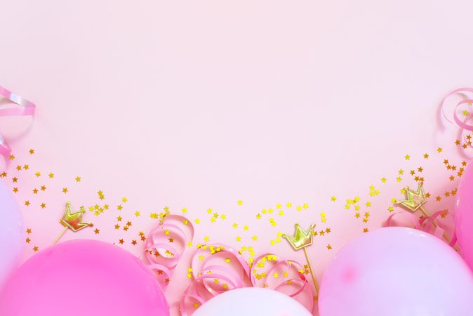 Pink birthday balloons on pink background with copy space