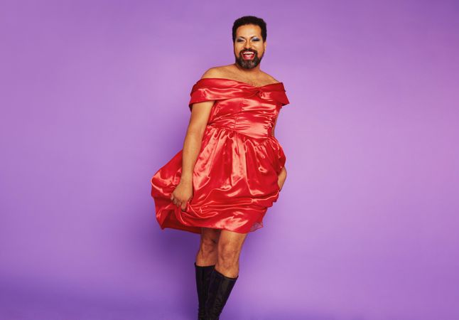 Gay model standing in female dress
