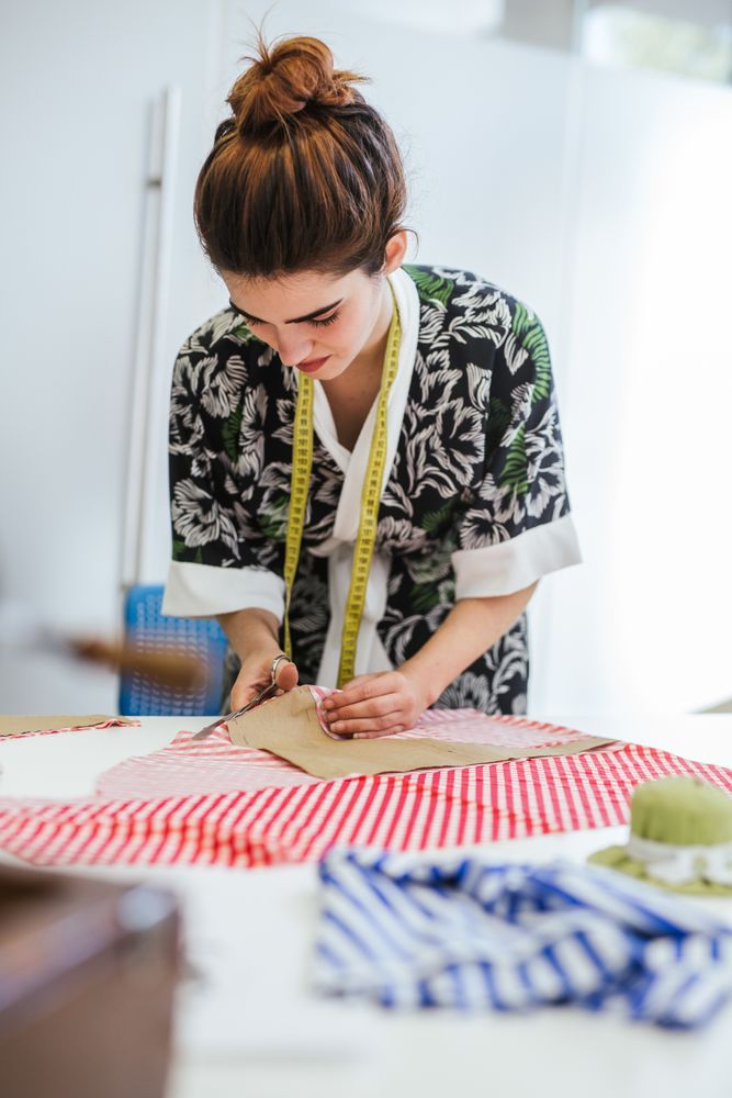Woman in a sewing school