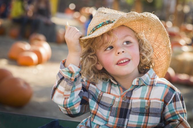 Little Boy in Cowboy Hat at Pumpkin Patch