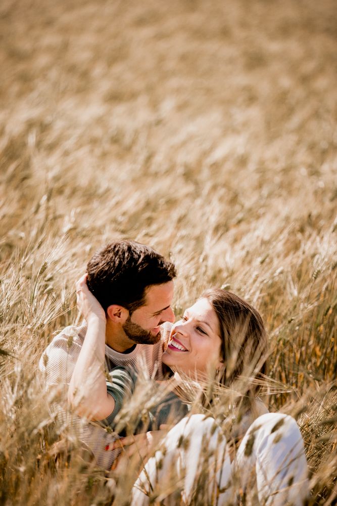 Serene lovers embracing on wheat field