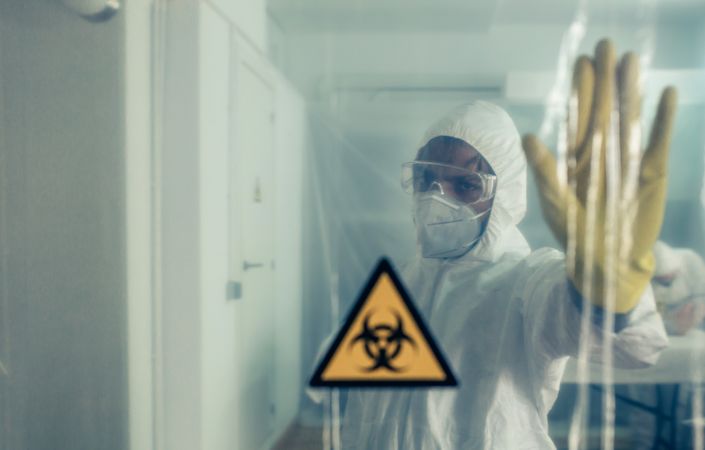 Male doctor prohibiting access to a restricted area