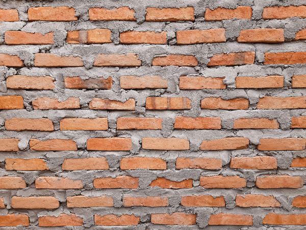 Old Red Brick Wall with Cement Mortar Texture for Architecture Background