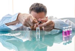Assistant making test with samples in laboratory