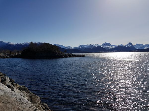 Body of water near mountain