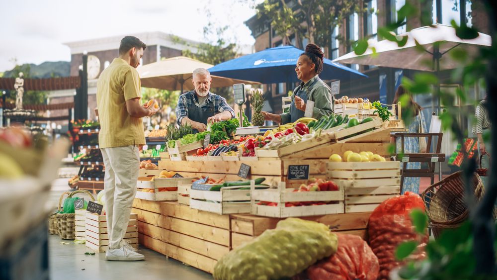 Man Buying Sustainable Bio Oranges From a Local Street Vendor