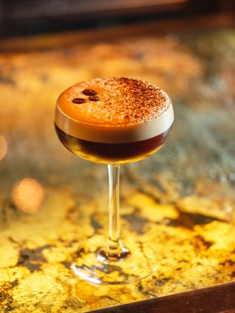 Espresso martini with coffee beans in bar