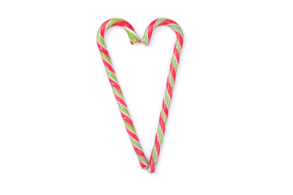 Sweet candy canes isolated on blank background