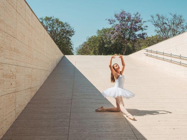 Ballerina performing classical position outside