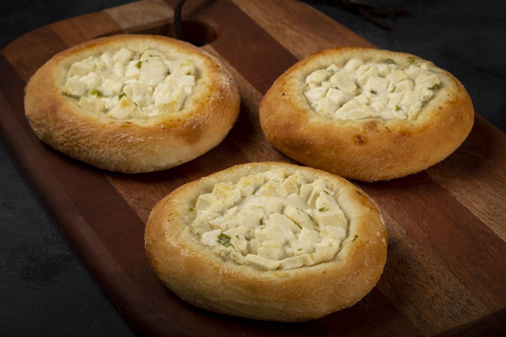 Arabic cheese sfiha on the table.