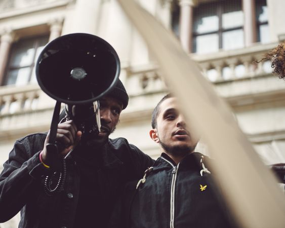 London, England, United Kingdom - June 6th, 2020: Two men at BLM protest with loudspeaker and signs