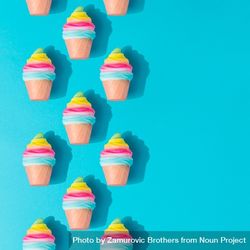 Pattern of colorful rows of ice cream on bright blue background 5op8z4