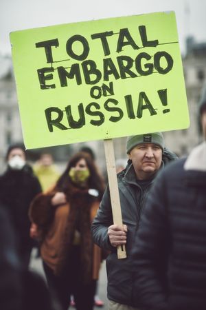 London, England, United Kingdom - March 5 2022: Man holding sign in support of Russian embargo