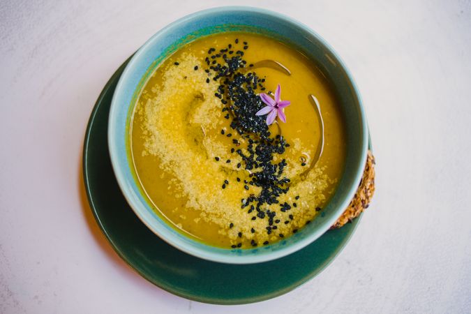 Tasty soup puree with seeds in bowl